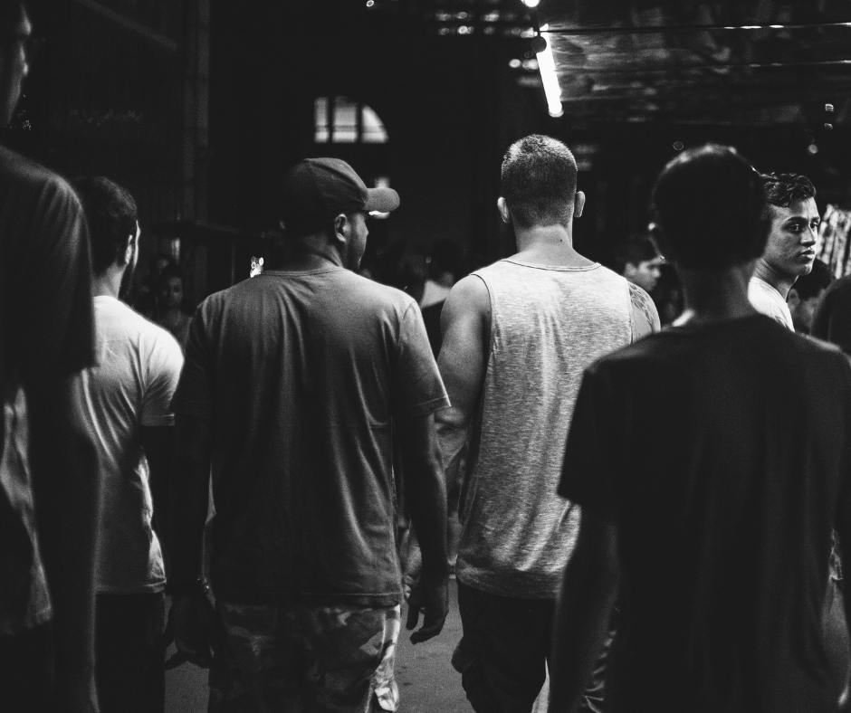 Group of young men with their backs to the camera