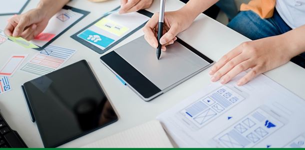People completing paperwork at a desk