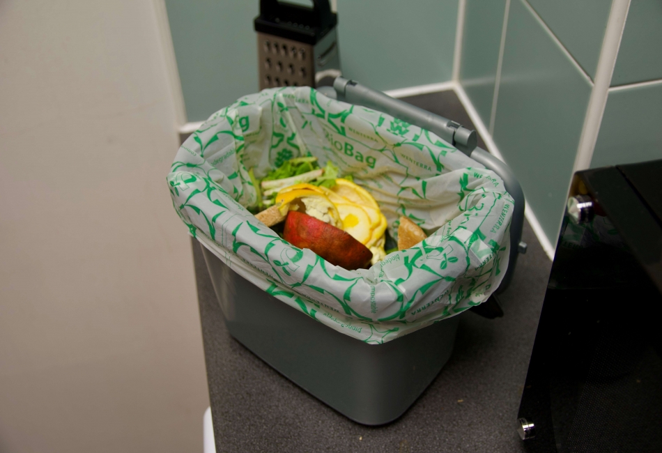 Picture showing a half full food waste caddy