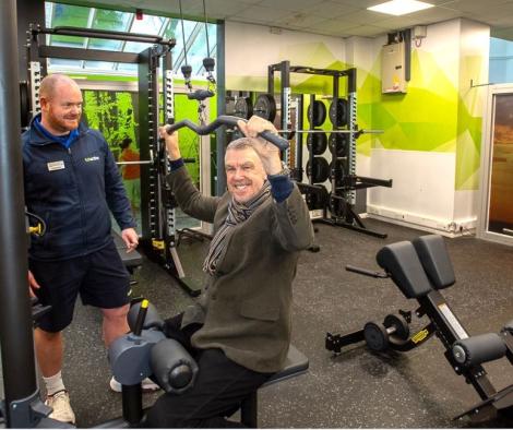 Cllr Des Keers trying out new gym equipment at Larkfield Leisure Centre.