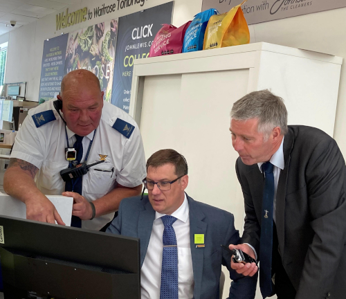 Local security officer, deputy manager of Waitrose Tonbridge and Gary Smith of Safer Towns Partnership study computer screen