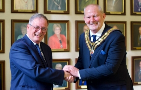 James lark and steve hammond shaking hands