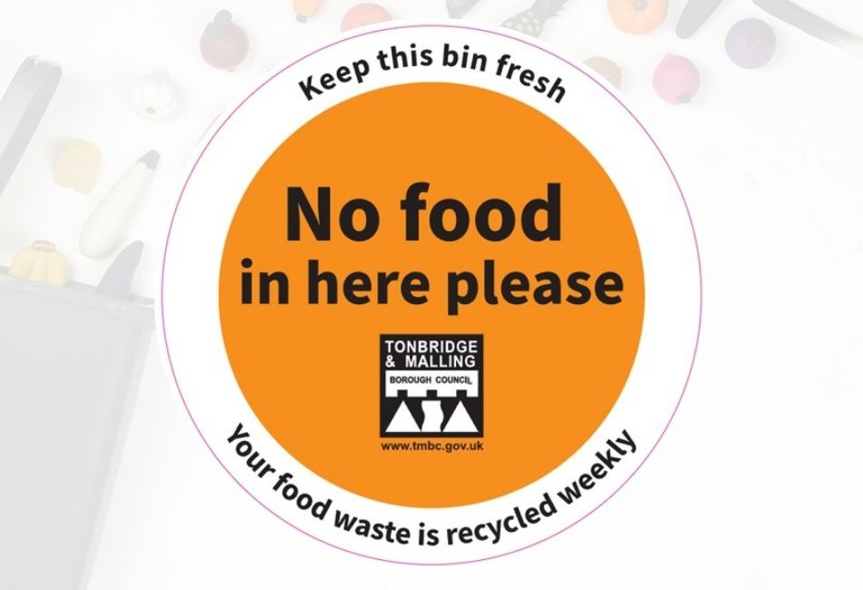A round orange graphic, saying &#039;No food here please&#039;