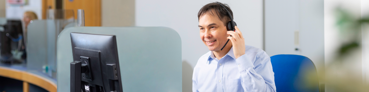 Man taking a phone call at reception