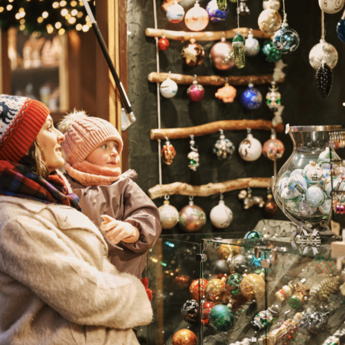 Woman and child looking at Christmas decoration stall