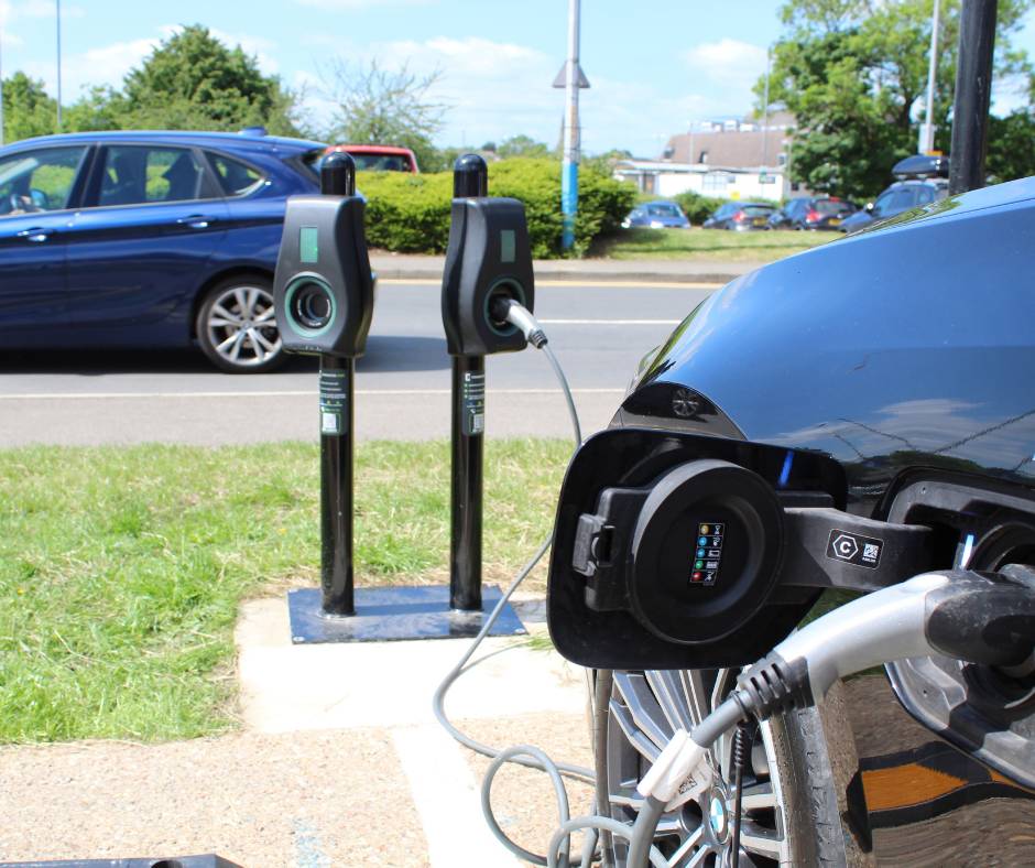 Car with electric charger inserted.