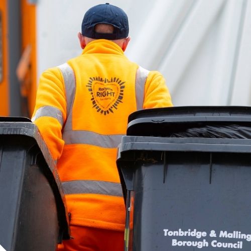 Officer collecting wheeled bins