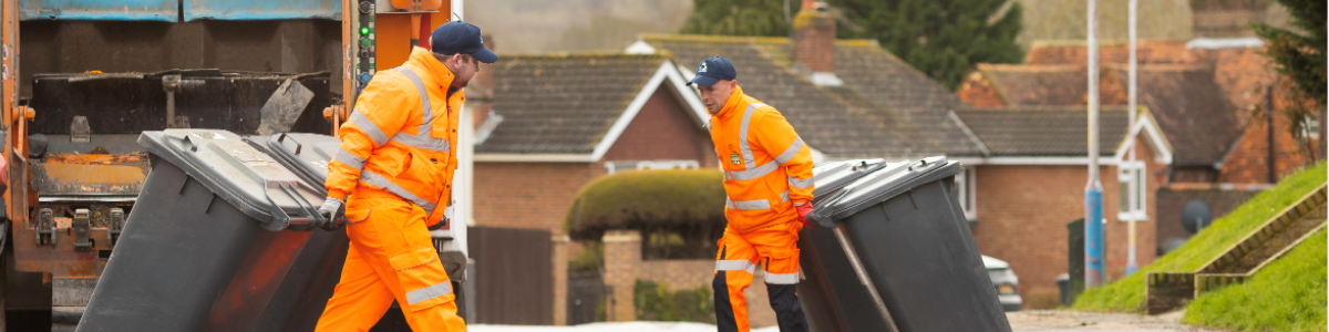 Waste crews emptying bins