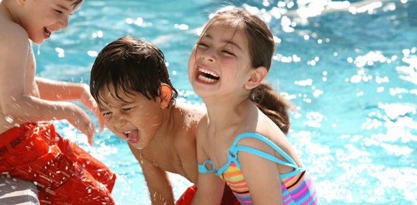 Three children in a swimming pool