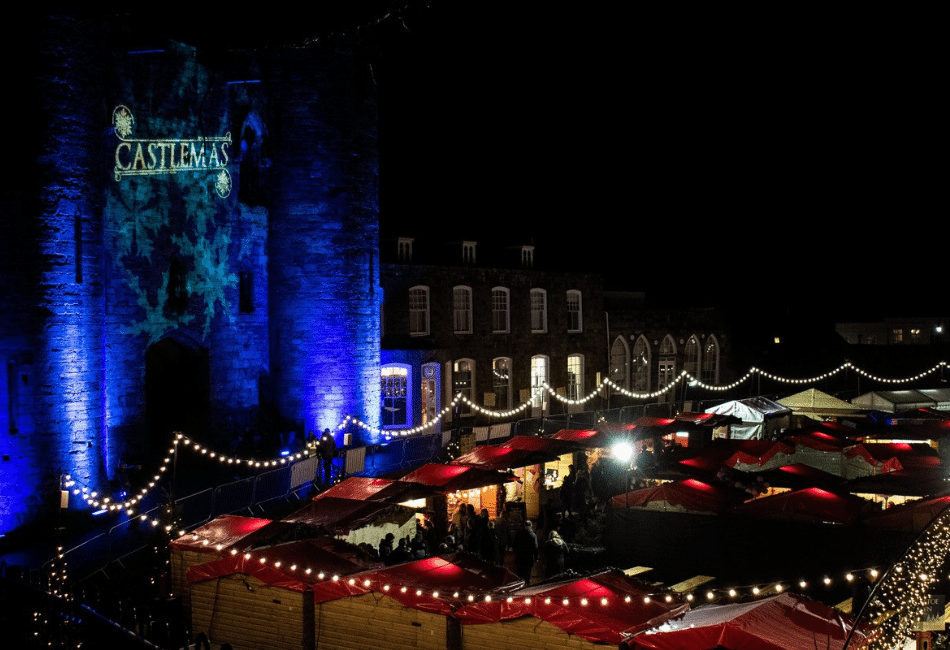Tonbridge Castle lit up with the Castlemas logo
