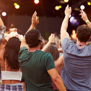 3 people watching live music