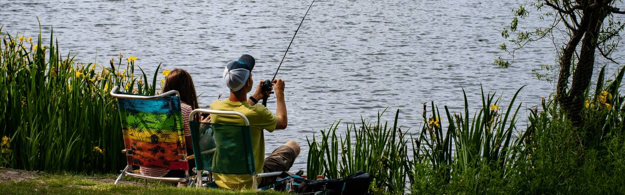 Man and woman fishing at a lake