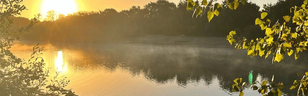 Sunrise over lake at the park