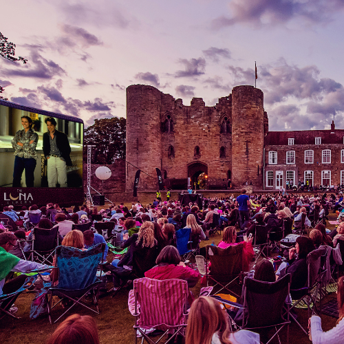 A crowd watching a film in the grounds of Tonbridge Castle
