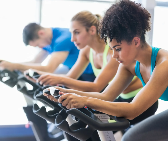 People on exercise bikes.